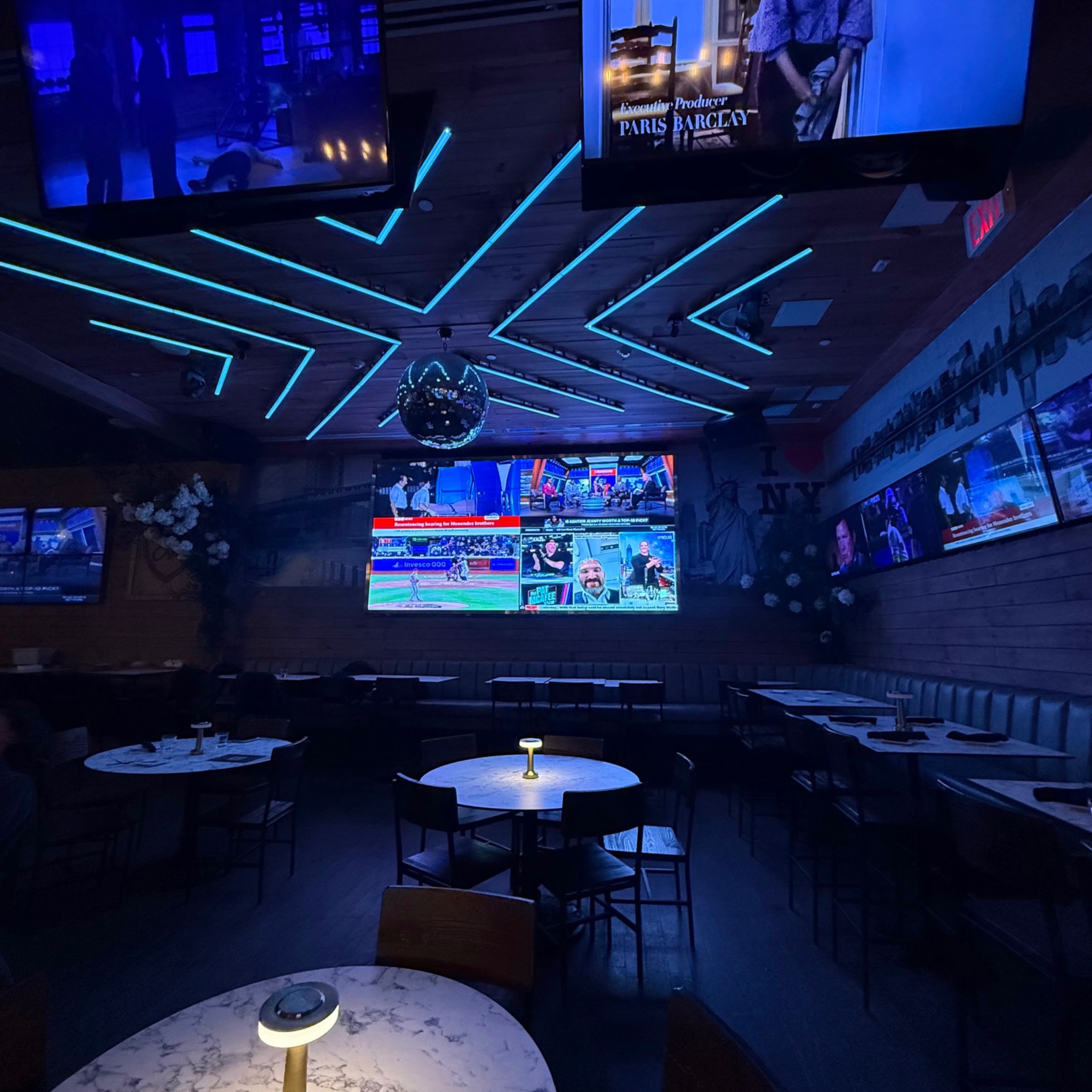 Restaurant and venue with integrated televisions and architectural lighting